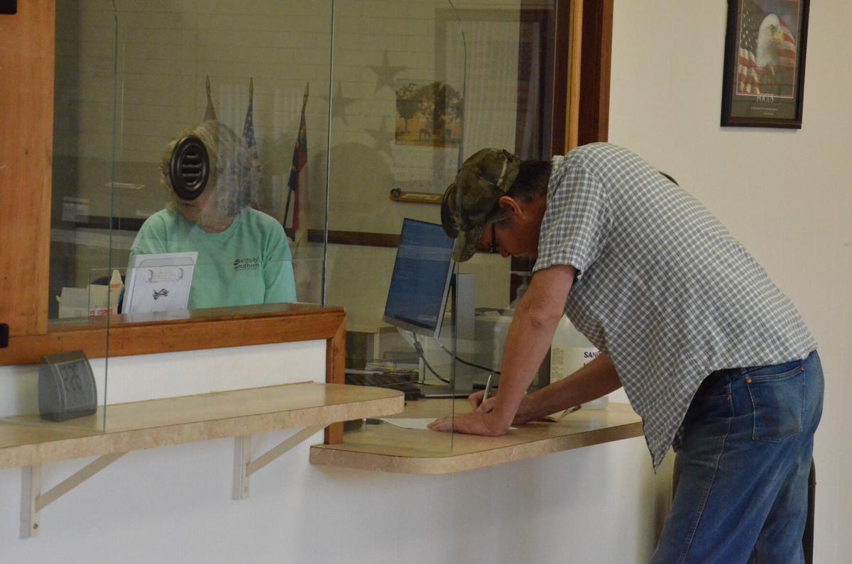 Phillip L. Baity files paperwork at the Iredell County Board of Elections on Friday in Statesville. He is running for the mayor of Love Valley.