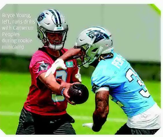 Bryce Young receiving help from Mac Jones as rookie