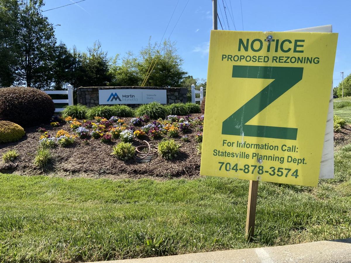 A sign notifying residents of a potential rezoning is placed near the entrance of Martin Marietta's quarry in Statesville.