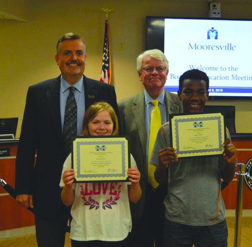 Students, teacher assistant recognized by Mooresville Graded School District board