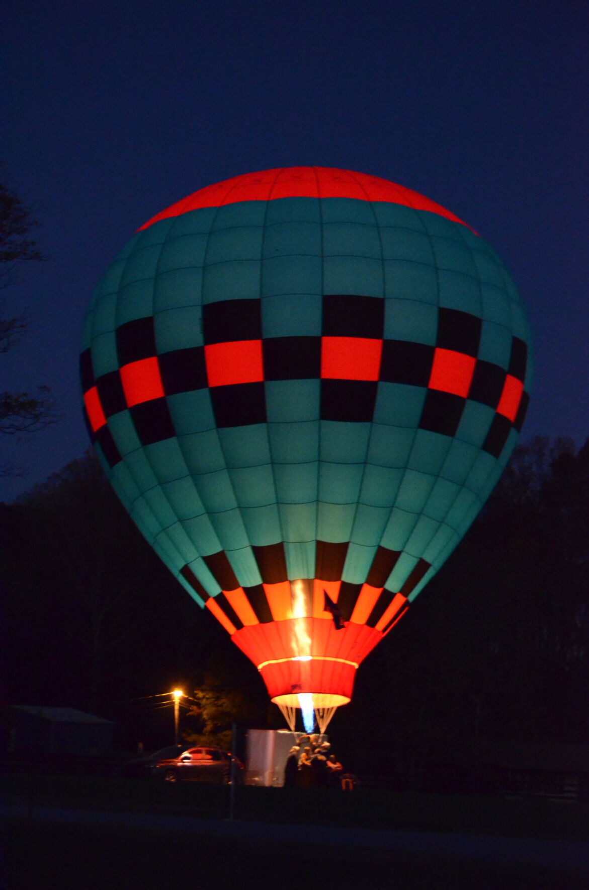 A hot air balloon sits outside Southern Distilling on Friday night in Statesville as part of Bourbon, Balloons & Battles.