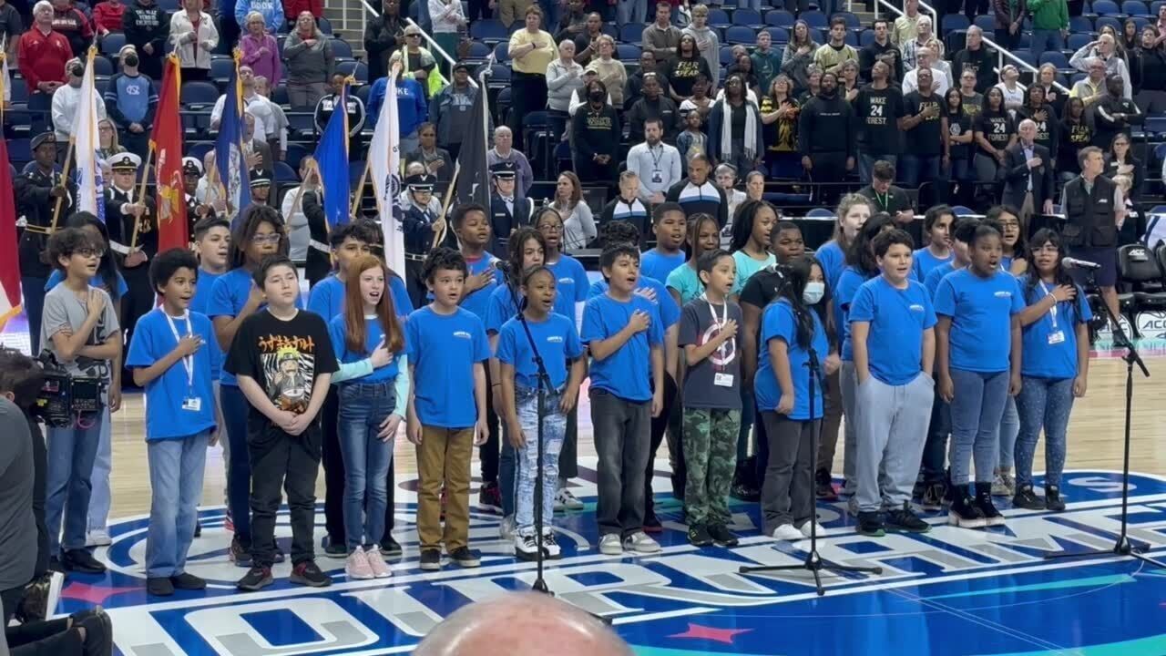 Elementary school kids sing the national anthem before the Wake  Forest-Louisville game in the ACC women’s basketball tournament.