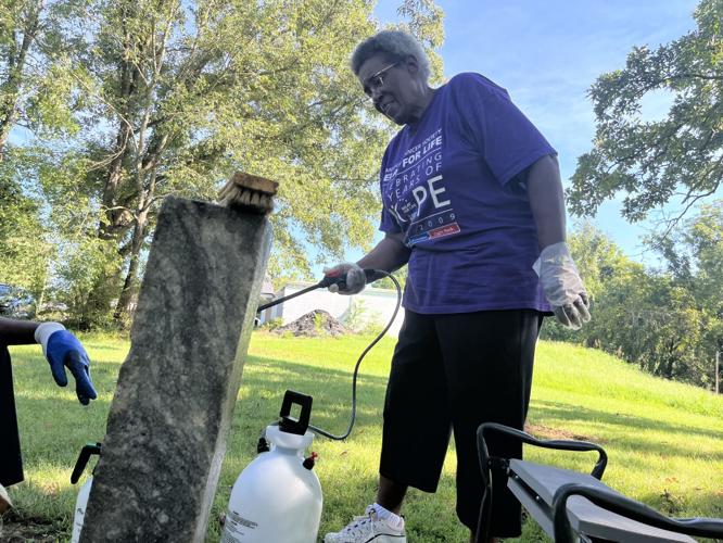 Preserving the past Volunteers apply elbow grease, love to headstones