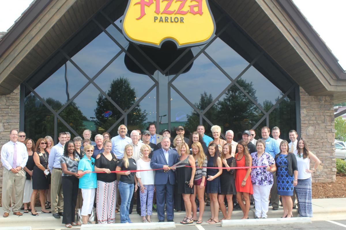 Village Inn celebrates new building, old roots