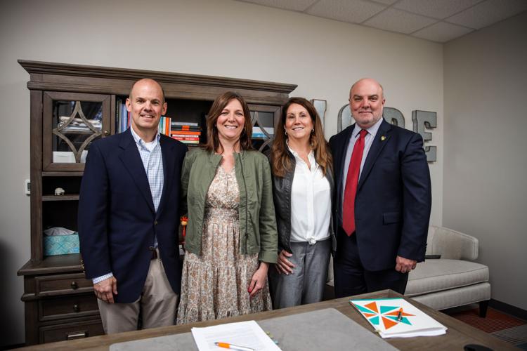 From leftt, Brian Mahoney, owner Prestige Acquisitions; Celeste Dominguez, CEO, Children's Hope Alliance; Ron Turner, CHA Property Board Chair; Kimberly Lawrence, CHA Board; Sen. Robert Davis, Prestige Acquisitions, pose for a photo as the two parties a...