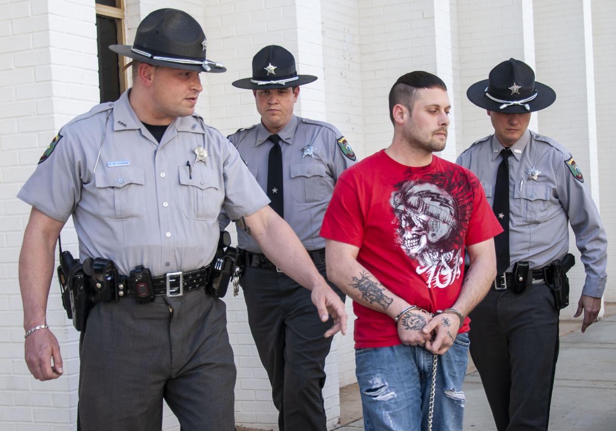 PHOTOS Moose murder suspect brought to Iredell County