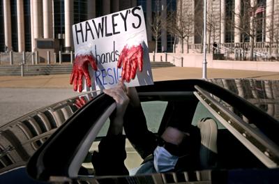 "Car-a-van" protest calls on Hawley to resign