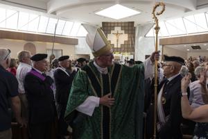 Cardinal Dolan returns home to a packed Ballwin church. 'This parish means everything'
