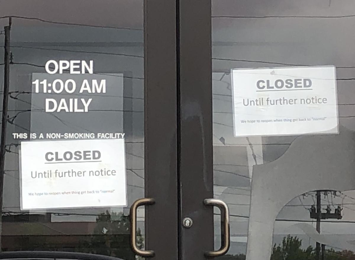 Closed signs at Hu Hot Mongolian Grill in Creve Coeur