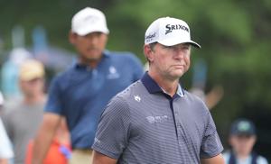 Lucas Glover heads down the fairway after driving the ball off the 1st tee to start of the third round of the ISCO Golf