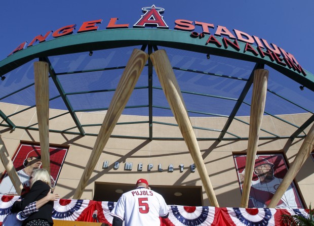 From left to right, Los Angeles Angels owner Arte Moreno, son of Albert  Pujols, Alberto Pujols Jr., owner Carole Moreno, wife of Albert Pujols, Deidre  Pujols, Albert Pujols, C.J. Wilson, general manager