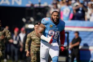 Tennessee Titans defensive tackle Jeffery Simmons (98) storms the field before the game against the Cleveland Browns at Nissan Stadium in Nashville, Tenn., Sunday, Oct. 25, 2026.