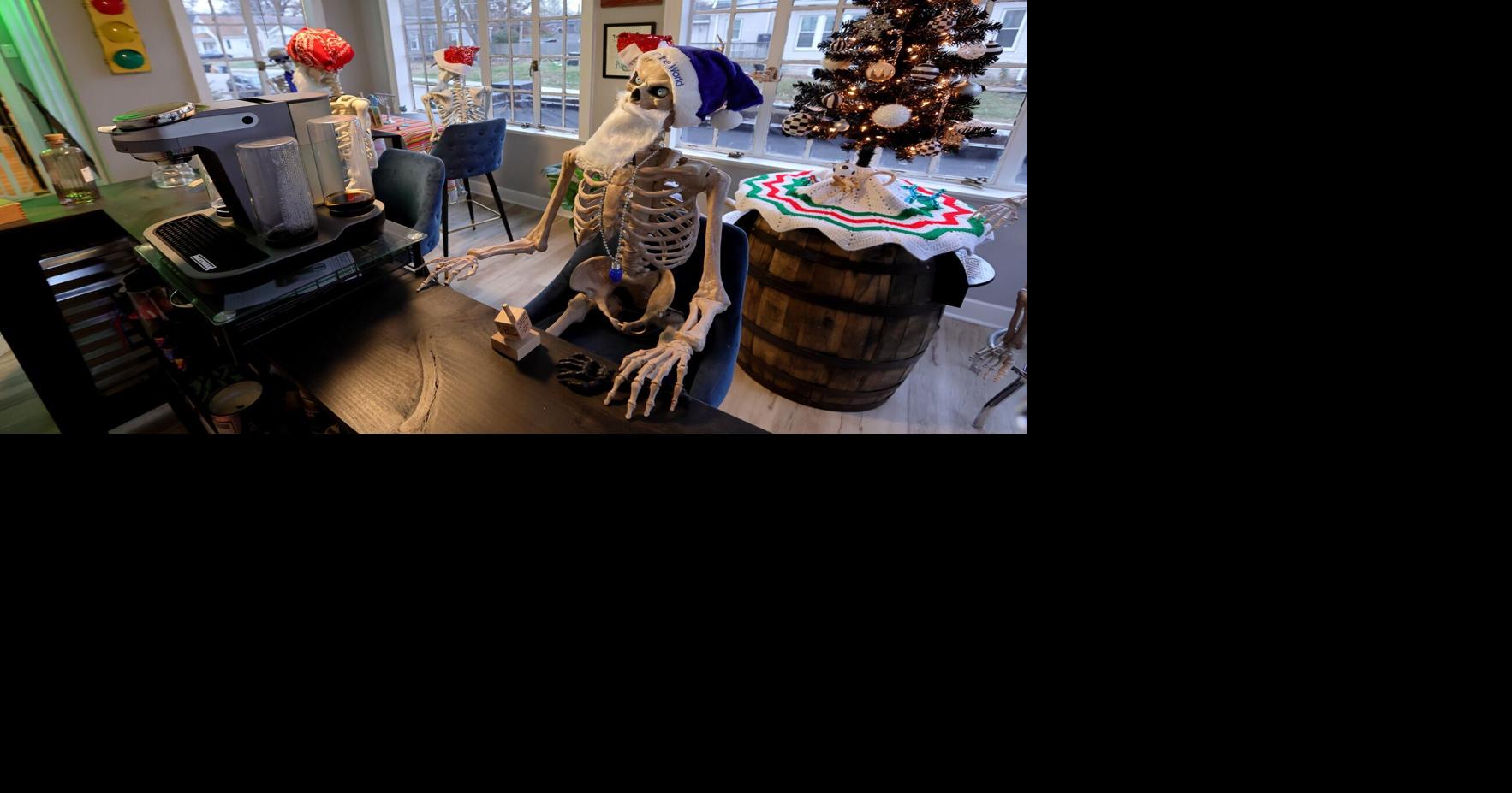 The Kalishses keep two full-size skeletons at a table in their bar that stay there year-round.