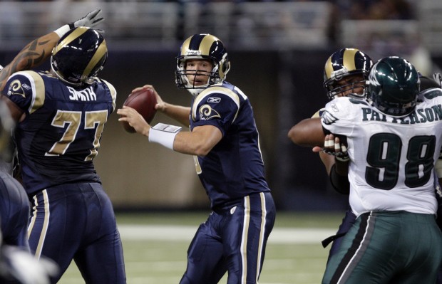 St. Louis Rams quarterback Sam Bradford enters the game for the first time,  clapping as he tries to get his team fired up against the Minnesota Vikings  in the second quarter of