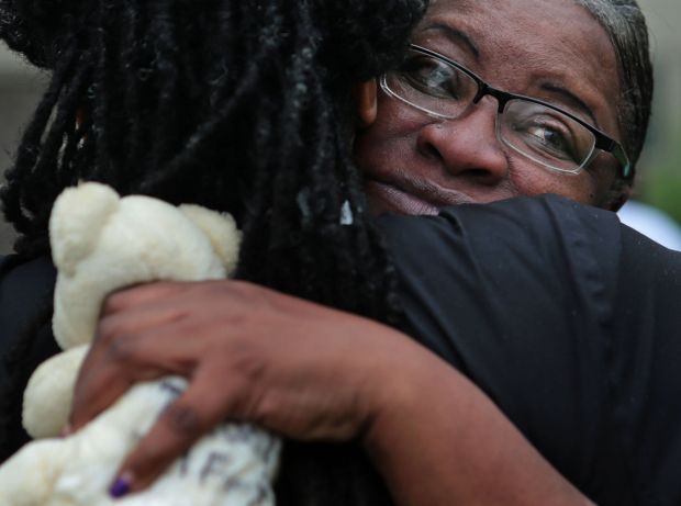 Rev. Tatman talks with residents