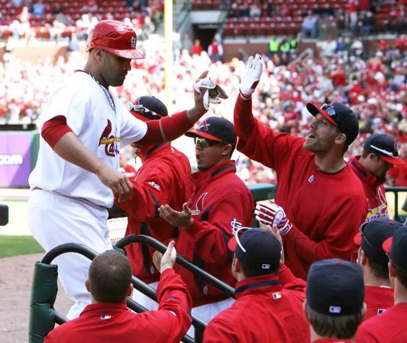 St. Louis Cardinals Lance Berkman embraces Albert Pujols after the