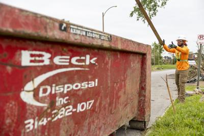 Local volunteer contractors come together to clear tornado damage from sidewalks and roads