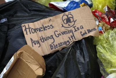 Residents of homeless camp at I-44 and Cole Street relocate