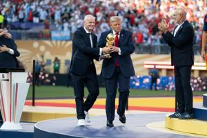 President Donald Trump and FIFA President Gianni Infantino present the World Cup Trophy to Spain during the FIFA World Cup 2026