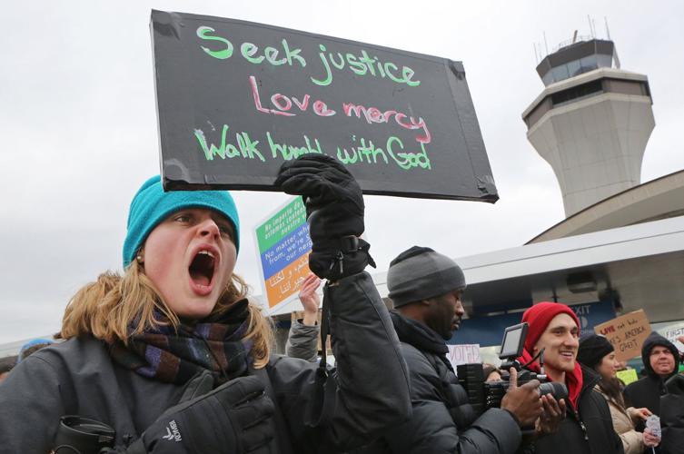 Protesters converge on Lambert over Trump policies