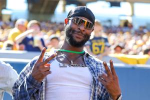 Former Pittsburgh Steeler football player Le'Veon Bell poses for a photo during the third quarter against the Robert Morris Colonials at Milan Puskar Stadium in Morgantown, West Virginia on Aug. 30, 2025.