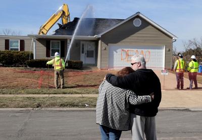 Crews demolish first of six hones on top of radioactive soil Monday near Coldwater Creek