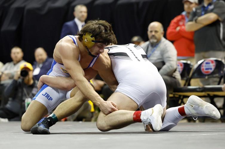 Troy's Smith thrives in overtime to earn repeat wrestling championship