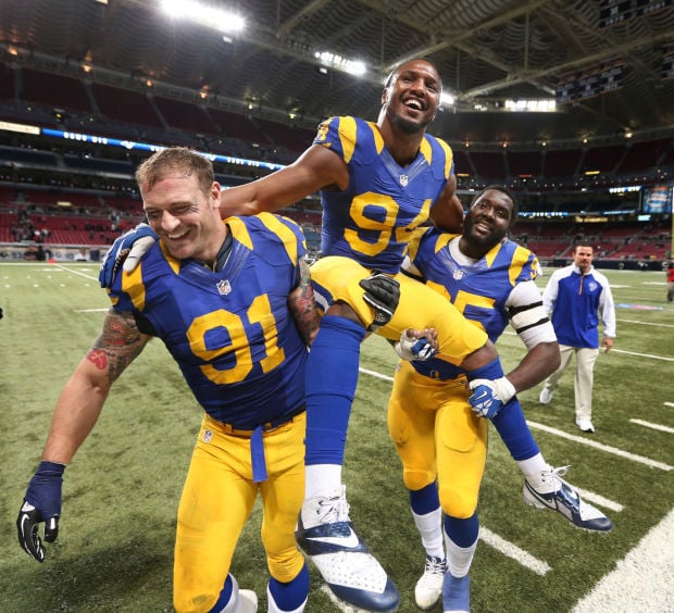 St. Louis Rams Marshall Faulk (L) congratulates Isaac Bruce after Bruce  scored a touchdown against the Seattle Seahawks in the first quarter at the  Edward Jones Dome in St. Louis on December