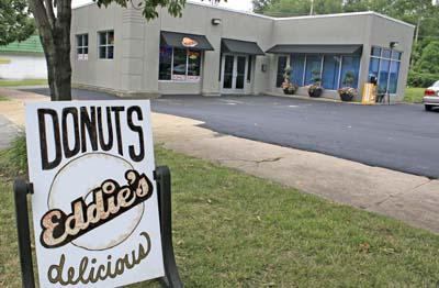 Something to chew on: Police move into doughnut shop's building. 