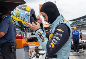 Ed Carpenter Racing driver Alexander Rossi (20) puts his helmet on Monday, May 18, 2026, during practice for the 110th running of the Indianapolis 500 at Indianapolis Motor Speedway.