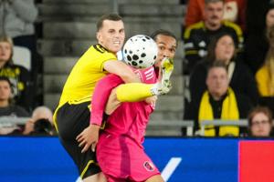 Columbus Crew defender Brooks Lennon (11) kicks a ball over St. Louis CITY SC forward Damion Downs (42) during the U.S. Open Cup