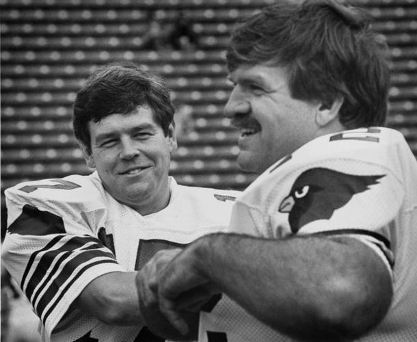 Quarterback Jim Hart of the St. Louis Cardinals drops back to pass