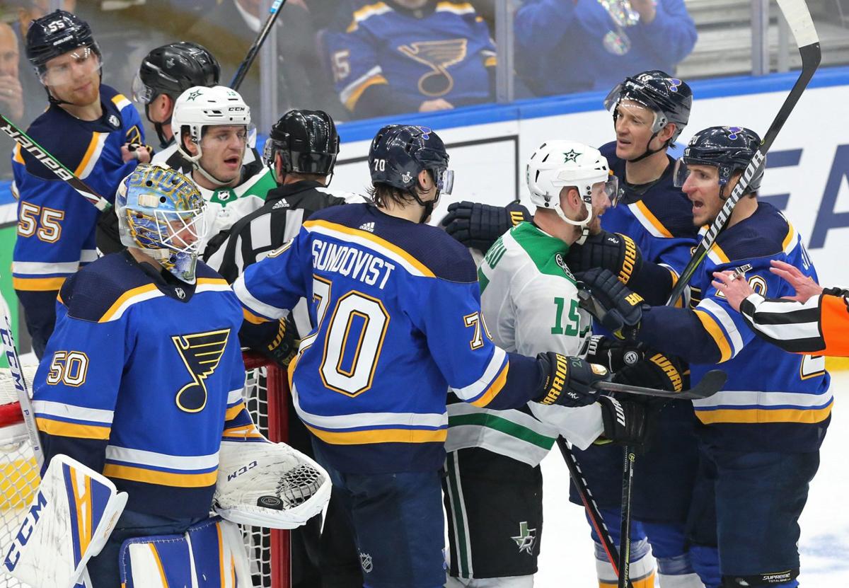 St. Louis Blues players line up to congratulate goaltender Ben Bishop after  the final horn against the Anaheim Ducks at the Scottrade Center in St.  Louis on February 19, 2011. St. Louis
