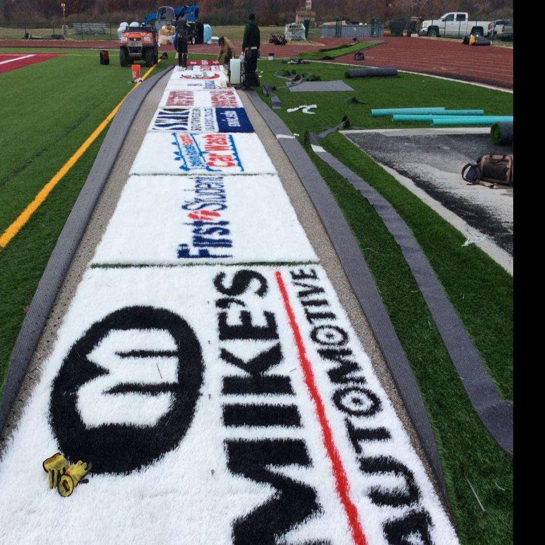 Ads Are Installed On Football Fields Turf At Belleville High