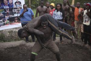 Tangling in mud, young Ugandans hold pro wrestling dreams