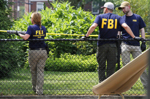 The Latest: Source: Guns in Va. shooting bought legally