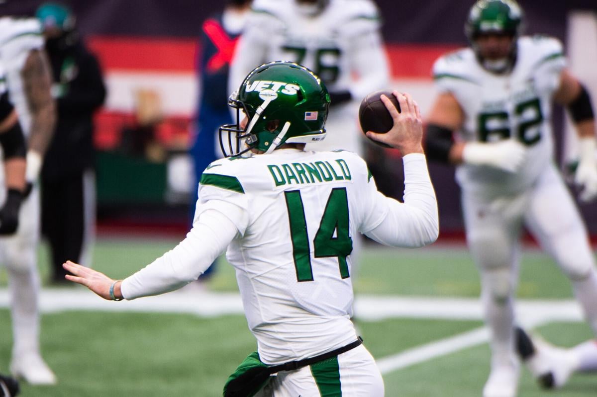 Sam Darnold of the New York Jets makes a pass against the New England Patriots in the first half on January 3, 2021 at Gillette Stadium in Foxborough, Massachusetts.