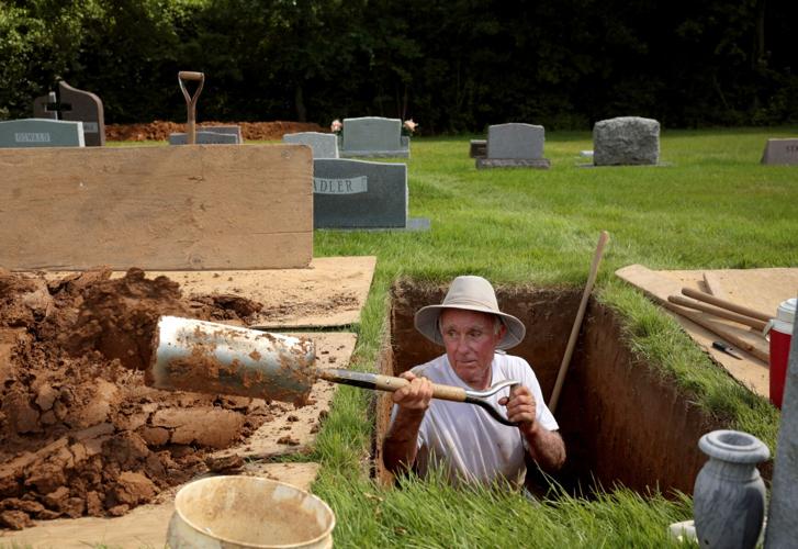 Grave digging done the old fashioned way in St. Charles