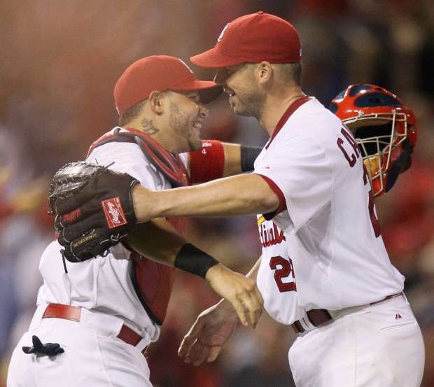 St. Louis Cardinals Lance Berkman embraces Albert Pujols after the