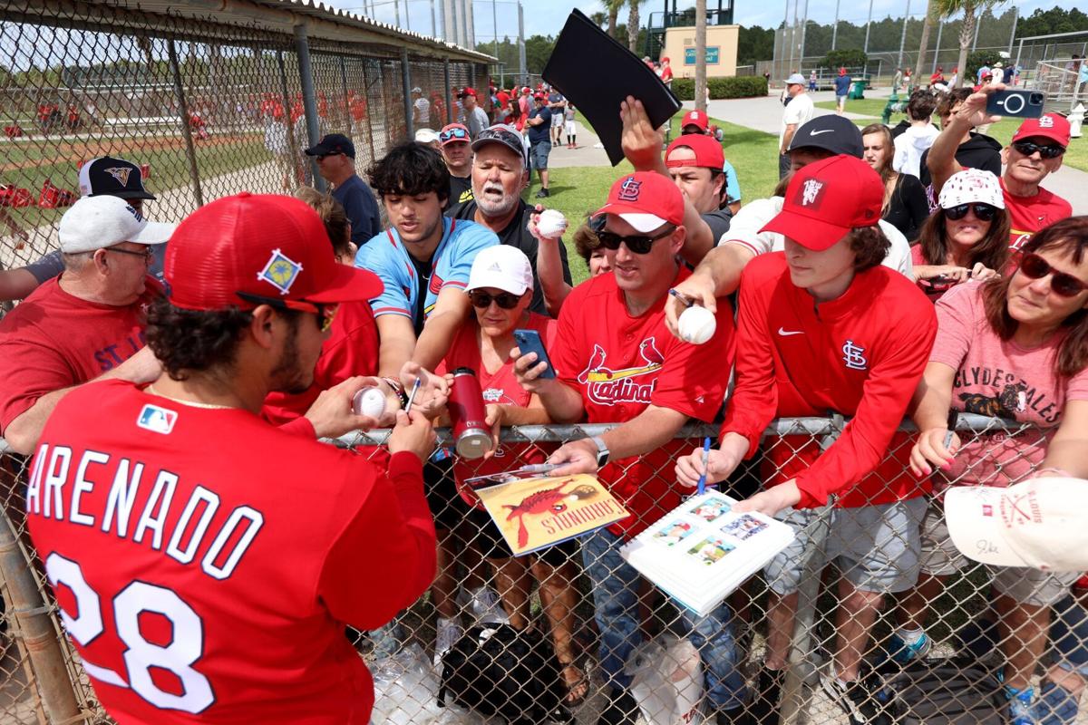 Cards' Marmol signs autographs as spring training camps open