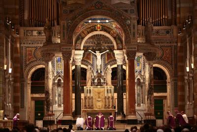 St. Louis Archbishop Robert Carlson (center) kneels at the Cathedral Basilica altar during a Mass of Reparation to address clergy sexual abuse on Friday, Sept. 7, 2018. Photo by Robert Cohen, rcohen@post-dispatch.com