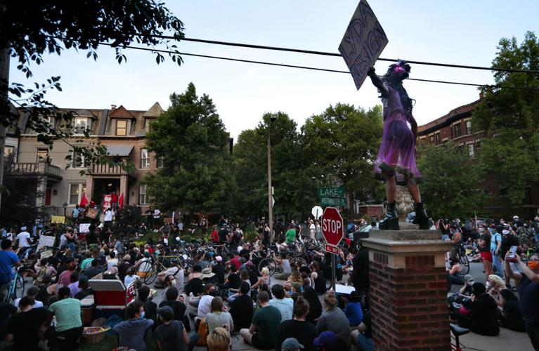 Protesters march to mayor's house