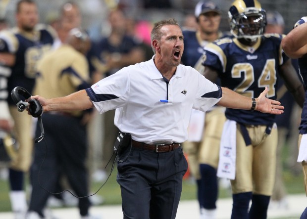 Arizona Cardinals quarterback Kurt Warner argues with a referee as