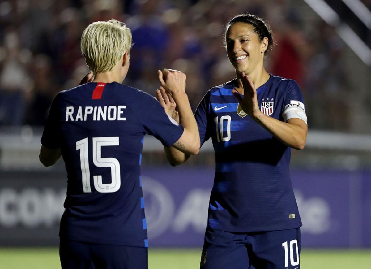 Megan Rapinoe #15 reacts after scoring a goal with teammate Carli Lloyd #10 of USA against Mexico during the Group A- CONCACAF Women's Championship at WakeMed Soccer Park on October 4, 2018 in Cary, North Carolina.