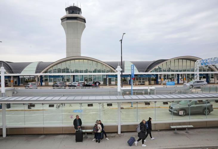 Impressive facade of St. Louis Lambert International Airport displaying modern architecture and busy roadways.