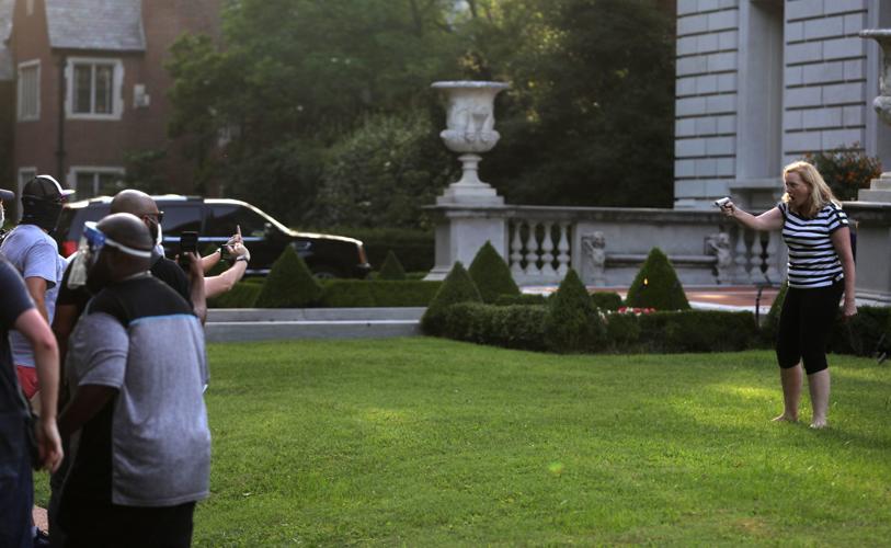 CWE couple display guns during protest