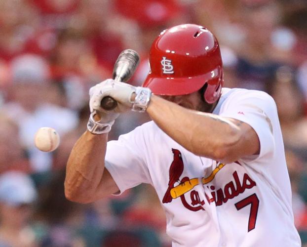 St. Louis Cardinals' Matt Holliday takes fastball to face 