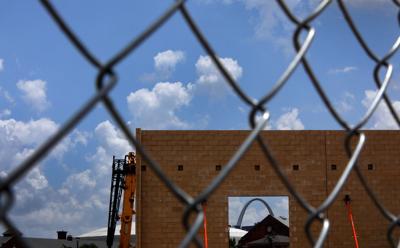 Grocery store, gas station rise north of downtown