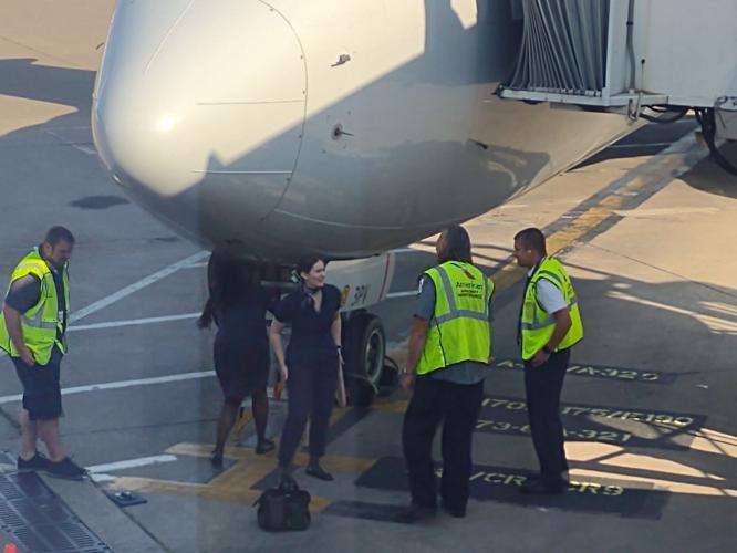 Flight attendants, others outside plane that returned to Lambert shortly after takeoff