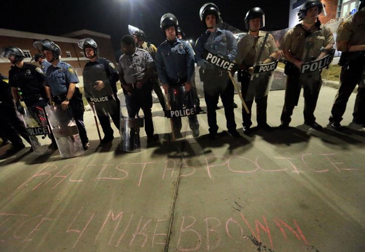 More than 150 demonstrators protest in front of Ferguson Police Station